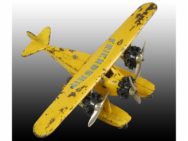 CAST IRON HUBLEY YELLOW TRI-MOTOR AIRPLANE TOY.   