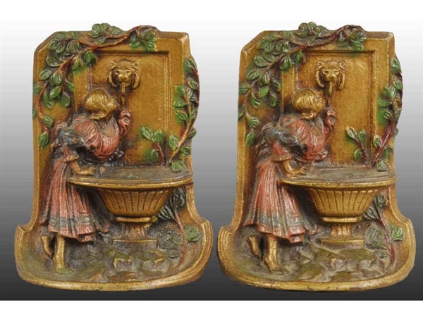 GIRL AT FOUNTAIN CAST IRON BOOKENDS.              