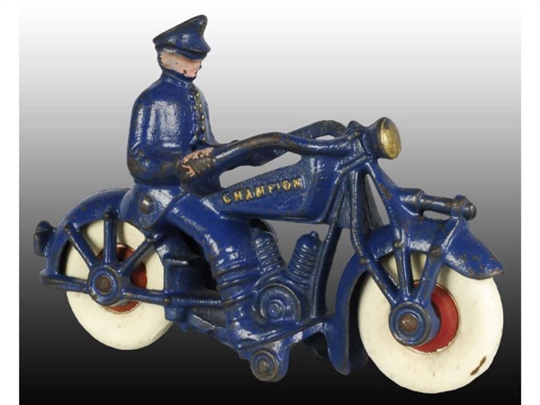 CAST IRON CHAMPION POLICE MOTORCYCLE TOY.         