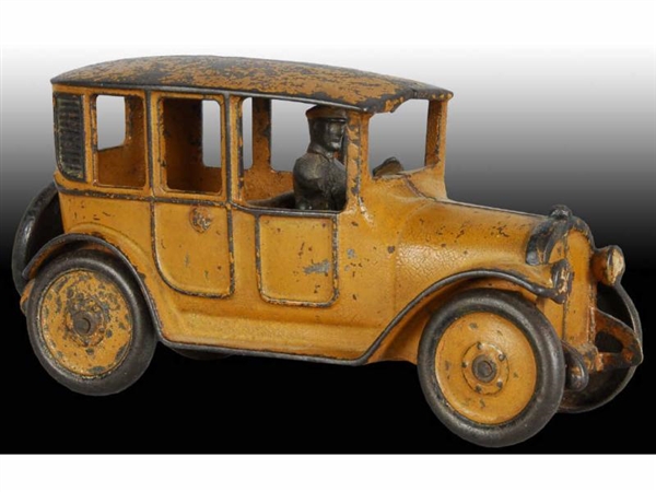CAST IRON HUBLEY YELLOW CAB CAR TOY.              