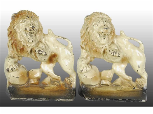 LION ON ROCKS CAST IRON BOOKENDS.                 