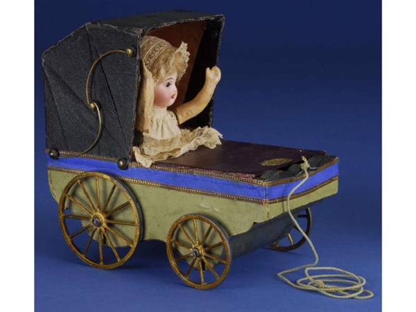 PULL TOY MECHANICAL CARRIAGE WITH BABY            