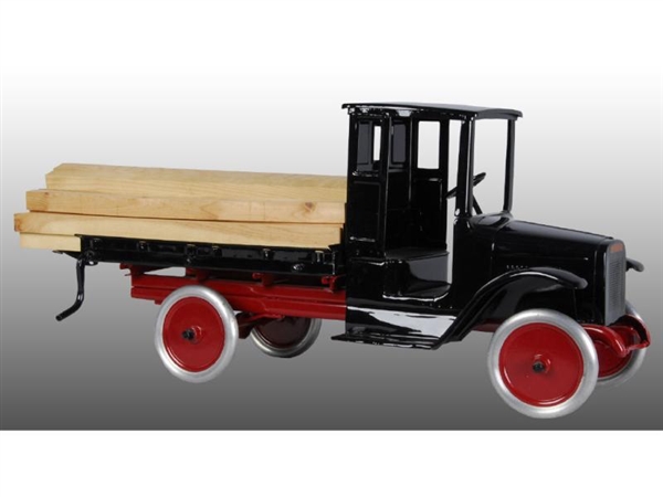 PRESSED STEEL BUDDY L LUMBER TRUCK WITH LUMBER.   