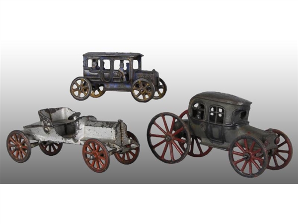 LOT OF 3: CAST IRON EARLY AUTOMOTIVE TOYS.        