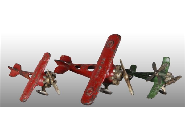 LOT OF 3: CAST IRON  TOY AIRPLANES.               