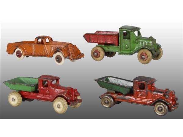 LOT OF 4: CAST IRON TRUCK TOYS.                   