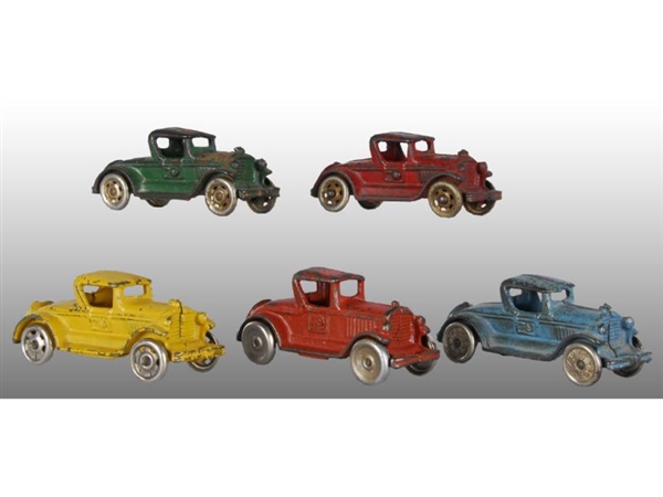 LOT OF 5: CAST IRON COUPE CAR TOYS.               