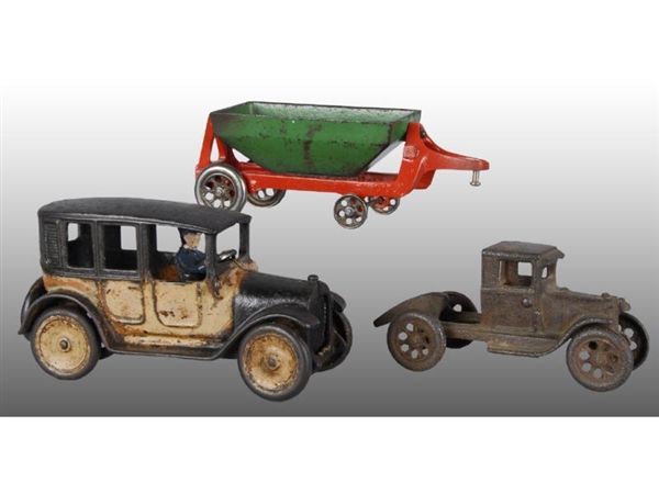 LOT OF 2: TOY CAST IRON TRUCKS, 1 WITH TRAILER.   