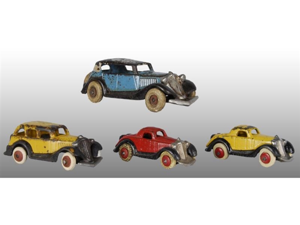 LOT OF 4: CAST IRON HUBLEY AUTOMOBILE TOYS.       