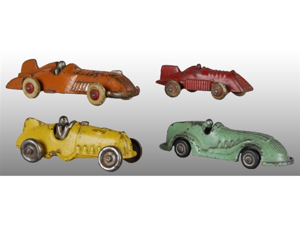 LOT OF 4: SMALL CAST IRON RACE CAR TOYS.          