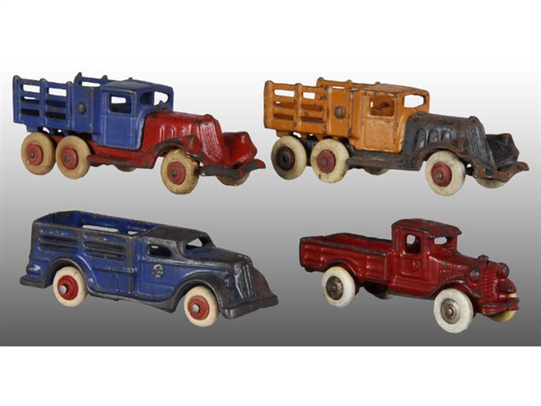 LOT OF 4: CAST IRON TRUCK TOYS.                   