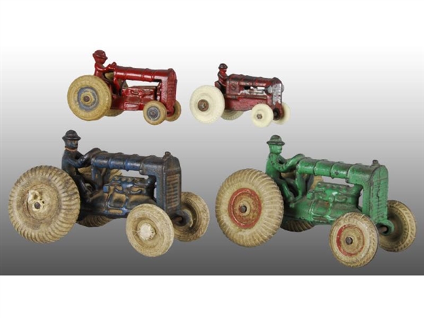 LOT OF 4: CAST IRON ARCADE TRACTOR TOYS.          