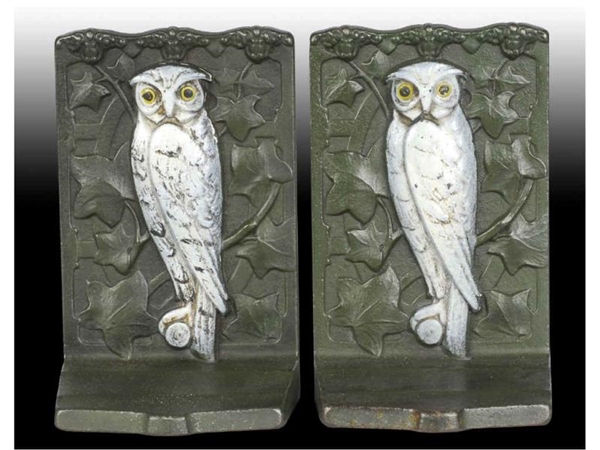 SNOWY OWL PERCHED ON BRANCH CAST IRON BOOKENDS.   