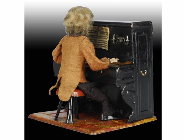 FRENCH TIN WIND-UP MARTIN PIANO PLAYER TOY.       