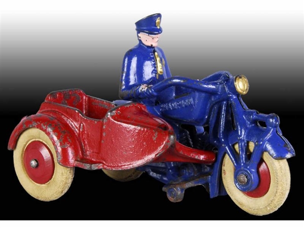 CAST IRON CHAMPION MOTORCYCLE COP WITH SIDE CAR.  