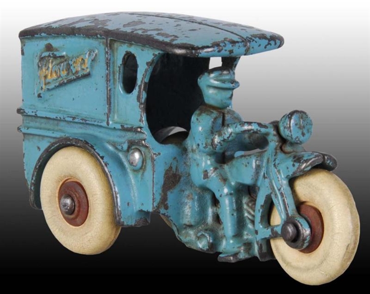 CAST IRON HUBLEY FLOWERS MOTORCYCLE TOY.          