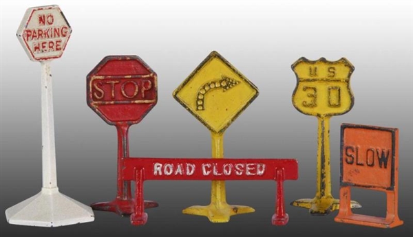 LOT OF: 6 CAST IRON ARCADE ROAD TOY SIGNS.        