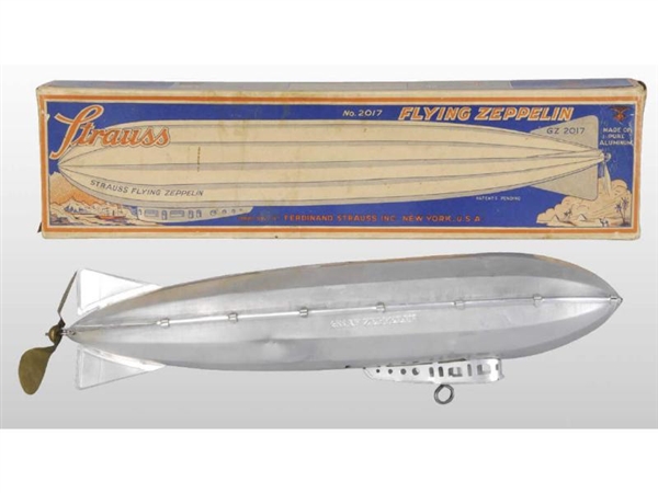 STRAUSS TIN WIND-UP FLYING ZEPPELIN WITH BOX.     