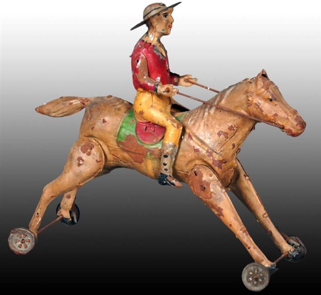 GERMAN TIN WIND-UP COWBOY ON HORSE TOY.           