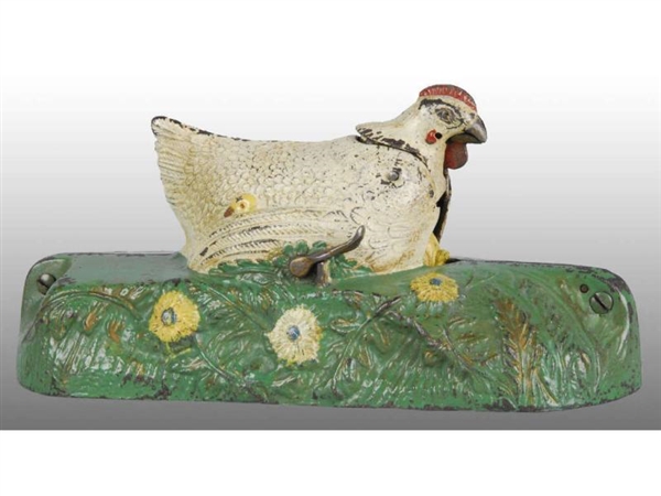 CAST IRON HEN AND CHICK MECHANICAL BANK.          