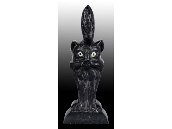 CAT WITH TAIL UP CAST IRON DOORSTOP.              