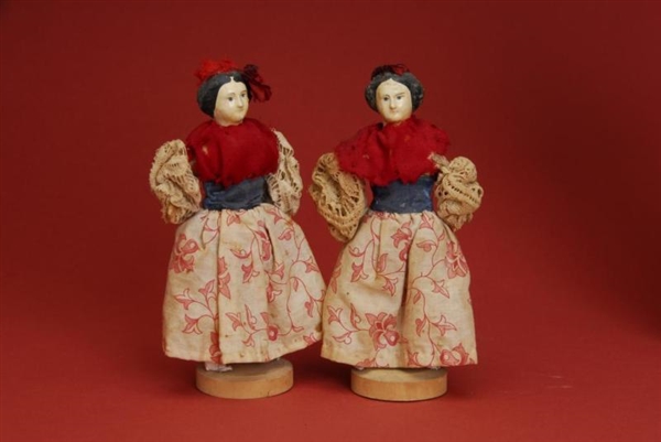 PAIR OF SMALL PAPIER MACHE DOLLS ON WOODEN BASES  