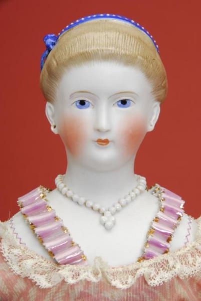 FINE QUALITY PARIAN LADY WITH MOLDED RIBBON TRIM  