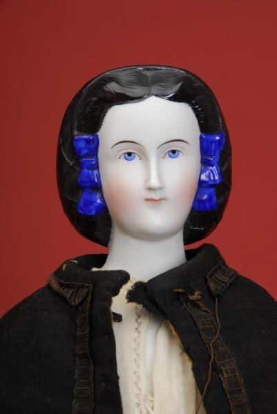 UNUSUAL PARIAN WITH BLACK HAIR AND SNOOD          