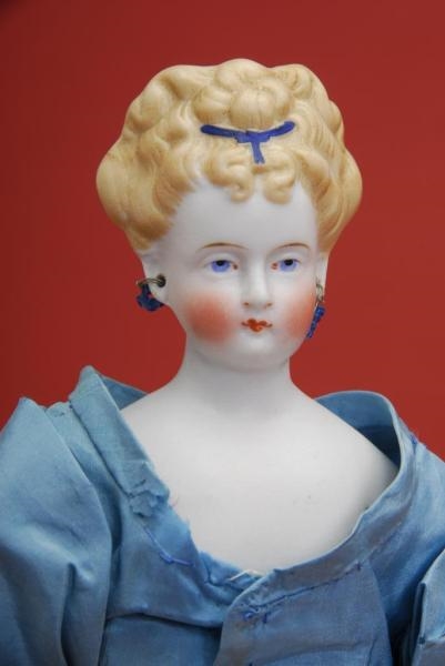 SMALL BLONDE PARIAN WITH PIERCED EARS             