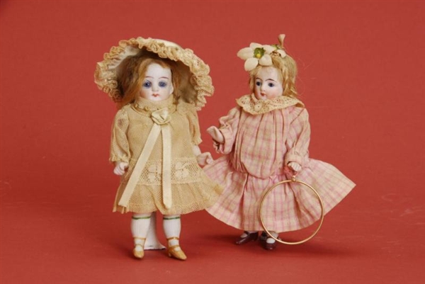 PAIR OF ALL BISQUE DOLLS                          