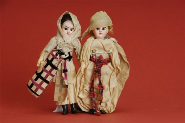 SMALL PAIR OF FRENCH DOLLS                        