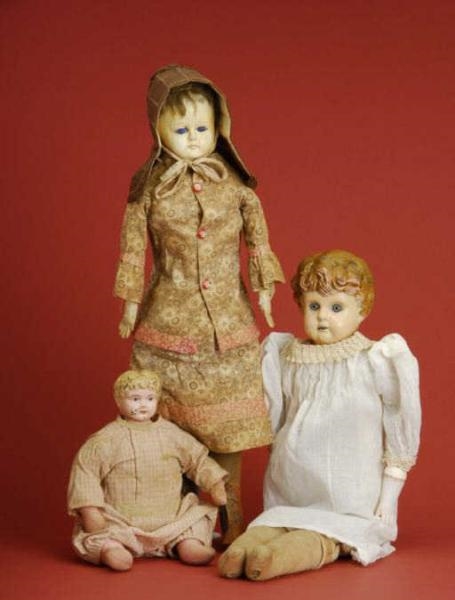 LOT: TWO TIN HEADS AND COMPOSITION DOLL           