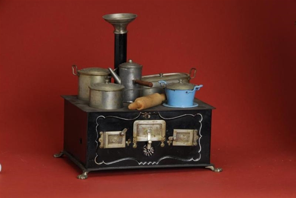 GERMAN TOY STOVE WITH COOKWARE                    