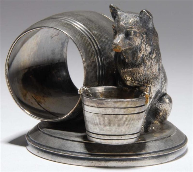 DOG WITH BUCKET FIGURAL NAPKIN RING.              