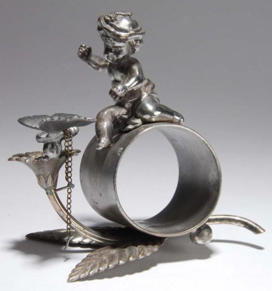 CHERUB WITH BUTTERFLY FIGURAL NAPKIN RING.        