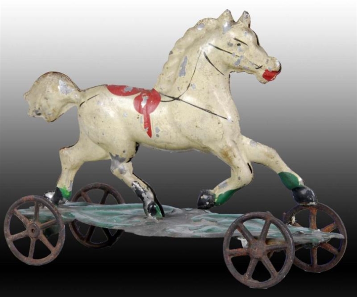 HAND-PAINTED AMERICAN TIN HORSE PLATFORM TOY.     