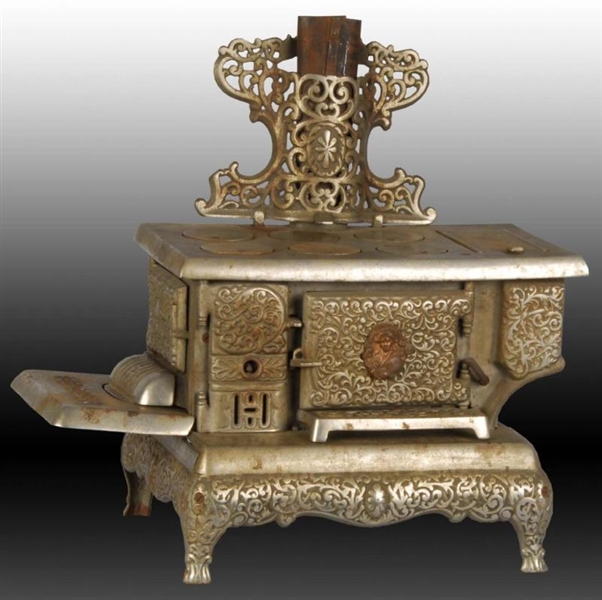 CAST IRON QUEEN CHILDRENS TOY STOVE.             