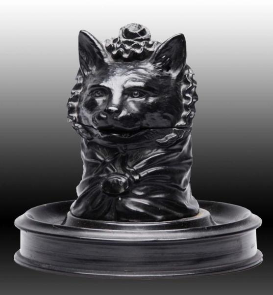  ANTIQUE METAL INKWELL OF A CAT  WEARING A BONNET.