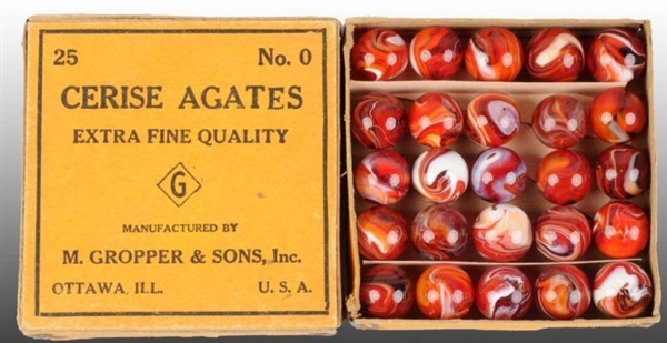 BOX OF CARNELIAN RED NO. 0 MARBLES.               