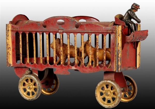 RED & GOLD  TIN CIRCUS CAGE WAGON TOY.            