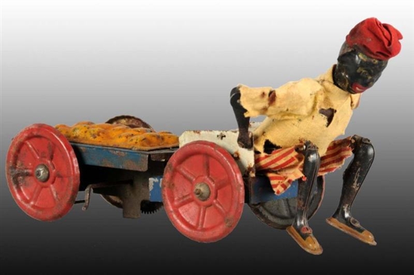 FRENCH MARTIN WIND-UP MAN PULLING CART TOY.       