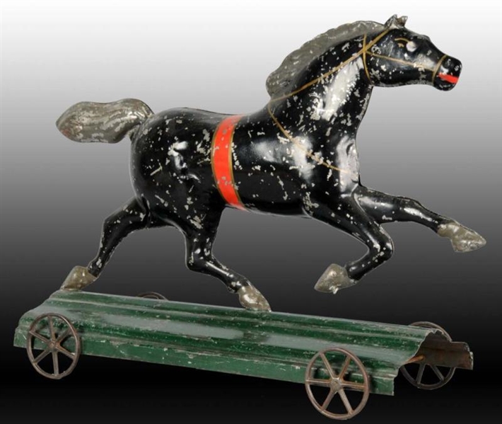 EARLY AMERICAN TIN HORSE TOY ON PLATFORM.         