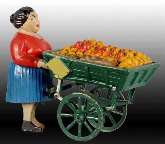 FRENCH COMPOSITION & TIN WOMAN FRUIT PEDDLER TOY. 