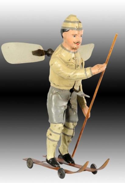 GERMAN TIN WIND-UP HAND-PAINTED SKIING TOY.       