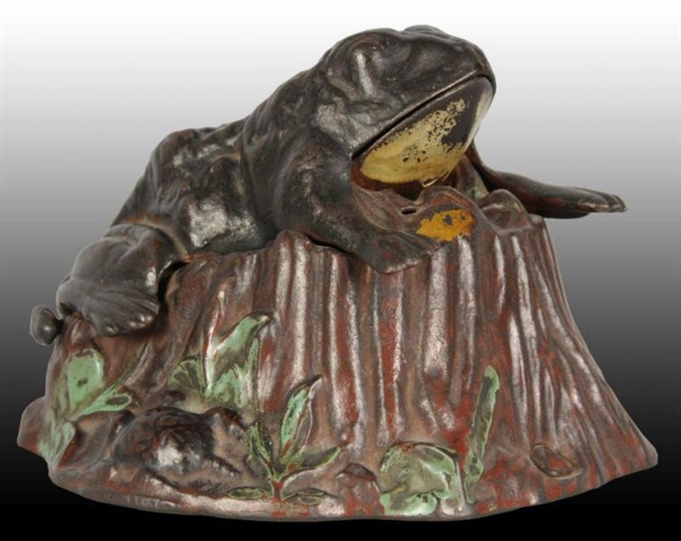 CAST IRON TOAD ON STUMP MECHANICAL BANK.          