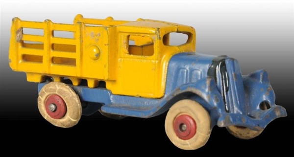 CAST IRON HUBLEY TAKE-A-PART STAKE TRUCK TOY.     