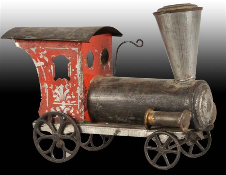EARLY AMERICAN TIN TOY TRAIN ENGINE.              