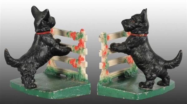 SCOTTIE LEANING ON ROSE FENCE CAST IRON BOOKENDS. 