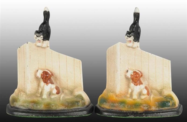 PUPPY WITH KITTEN ON FENCE CAST IRON BOOKEND.     