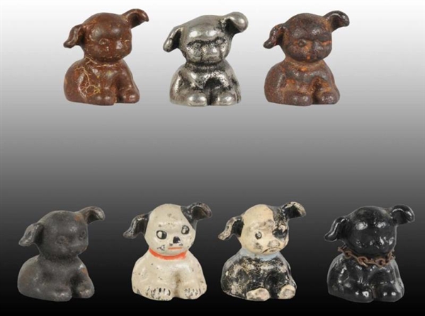LOT OF 7: PUPPO DOG CAST IRON PAPERWEIGHTS.       